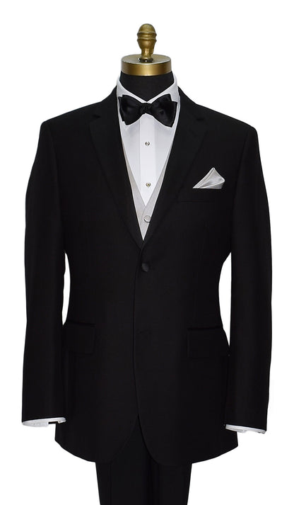 Black tuxedo with white dress shirt and moonlight-vest with a black "pre-tied" bow tie and pocket handkerchief on a mannequin against a white background