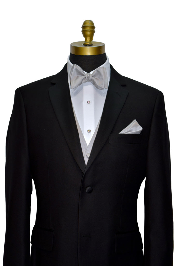 Black notch-lapel tuxedo with white dress shirt and moonlight-gray "self-tie" bow tie and moonlight-gray tuxedo vest on a mannequin against a white background