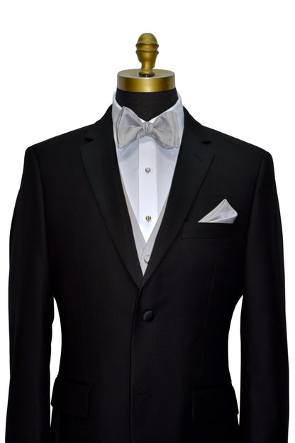 Black notch-lapel tuxedo with white dress shirt and moonlight-gray "self-tie" bow tie and moonlight-gray tuxedo vest on a mannequin against a white background