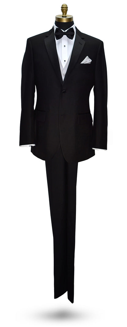 life-size mannequin wearing a Black notch-lapel tuxedo with white dress shirt and moonlight tuxedo vest with a black "pre-tied" bow tie and pocket handkerchief on a mannequin against a white background