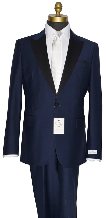 Navy blue tuxedo on a mannequin with a white shirt and white necktie-against a white background