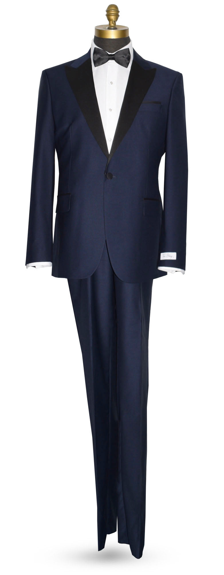 Navy blue tuxedo with black lapels and a black bowtie on a mannequin against a white background