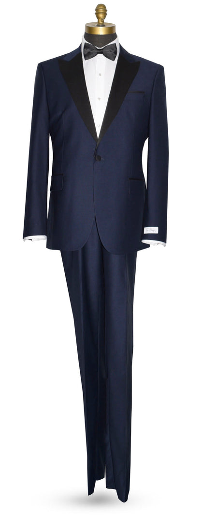 Navy blue tuxedo with black lapels and a black bowtie on a mannequin against a white background