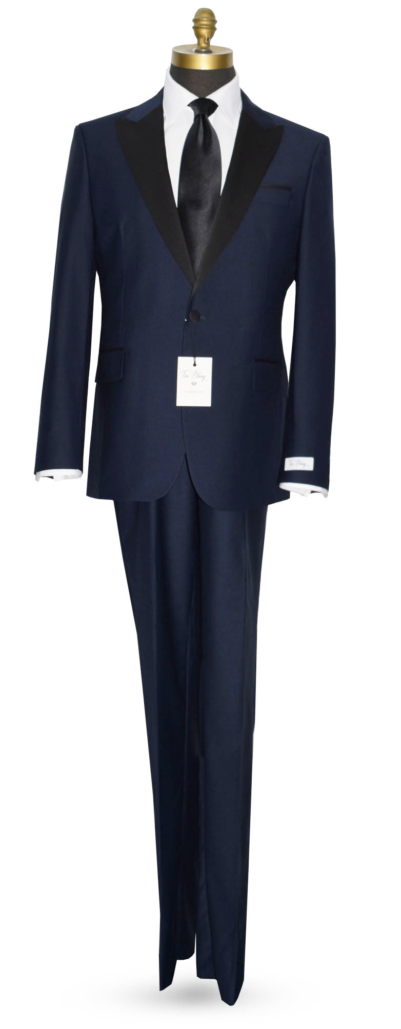 Navy blue tuxedo on a mannequin with a long black necktie against a white background
