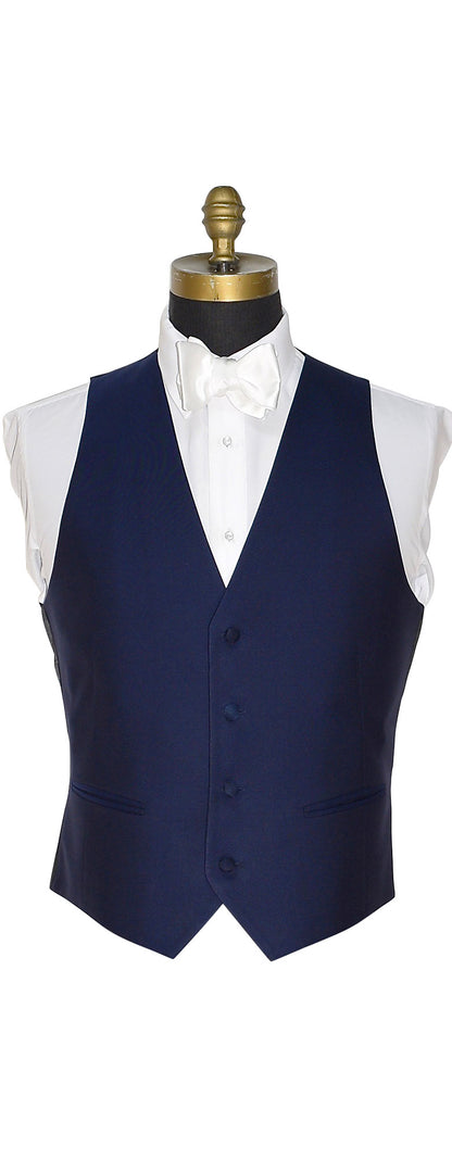 Close up view of a optional Navy blue vest for the navy notch tuxedo shown with a white satin "tie-yourself" bowtie  against a white background