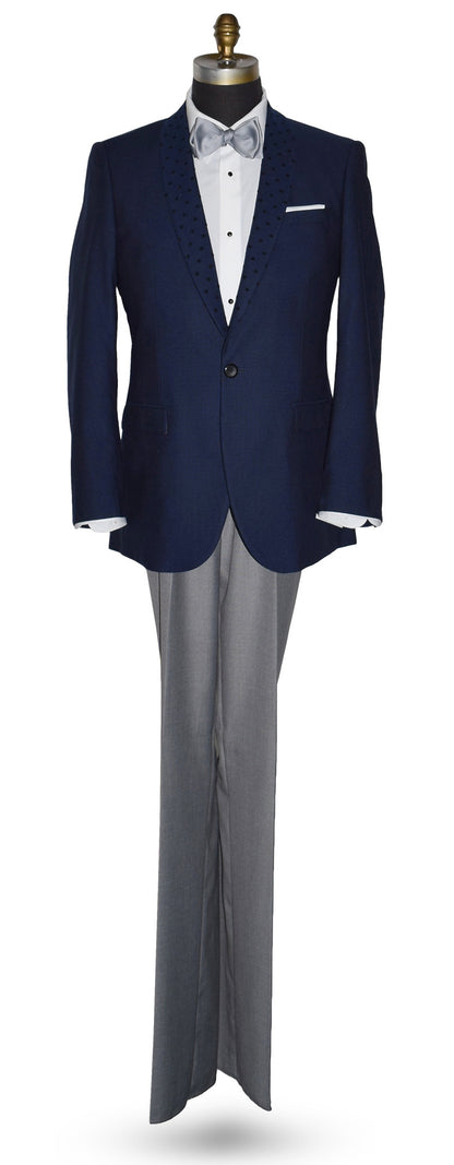 life size mannequin wearing a navy blue shawl collar dinner jacket  with gray pants and a gray tie-yourself bowtie on a mannequin against a white background