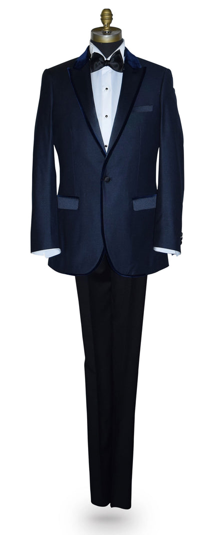 Navy blue tuxedo with navy blue velvet trim on a mannequin against a white background