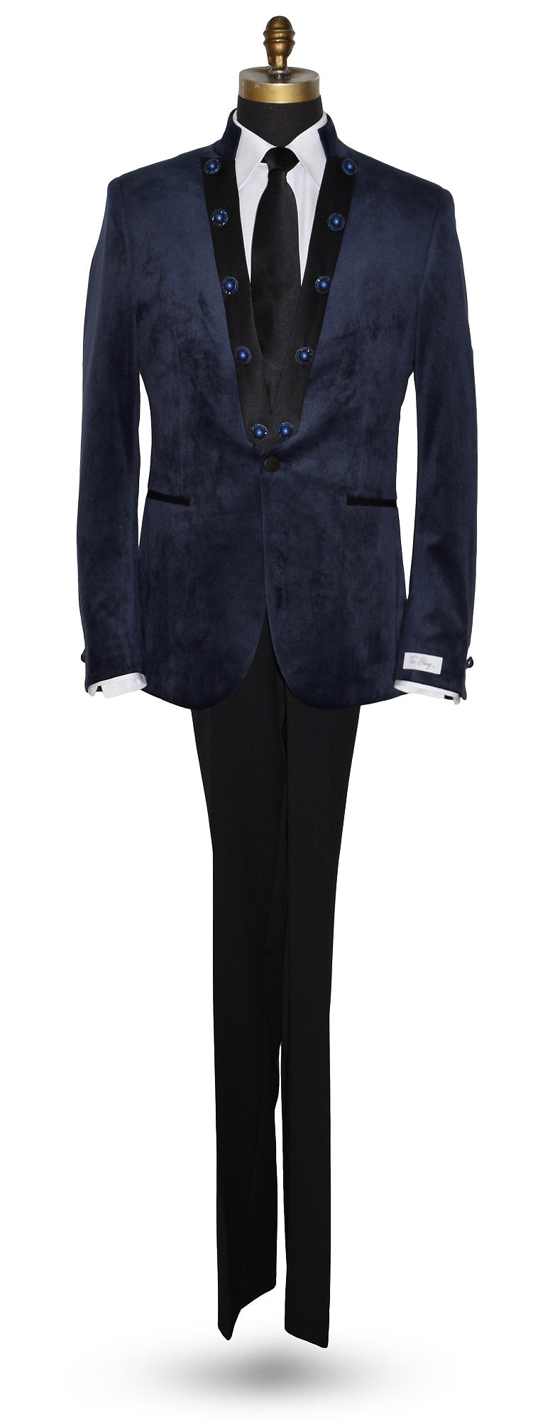 life size mannequin wearing a navy velvet nehru collar tuxedo with a long black dress tie against a white background