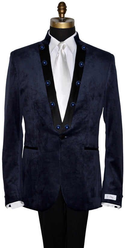 close-up front view mannequin wearing a navy velvet nehru collar tuxedo with a long white dress tie against a white background