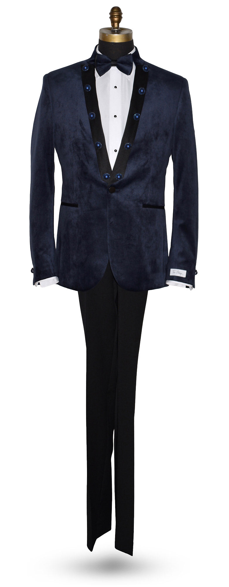 life size mannequin wearing a navy velvet nehru collar tuxedo with a navy bowtie against a white background