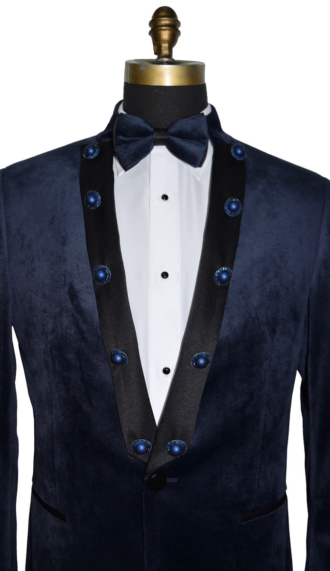 close-up mannequin wearing a navy velvet nehru collar tuxedo with a navy bowtie against a white background