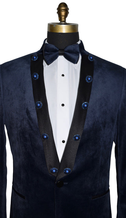 close-up mannequin wearing a navy velvet nehru collar tuxedo with a navy bowtie against a white background