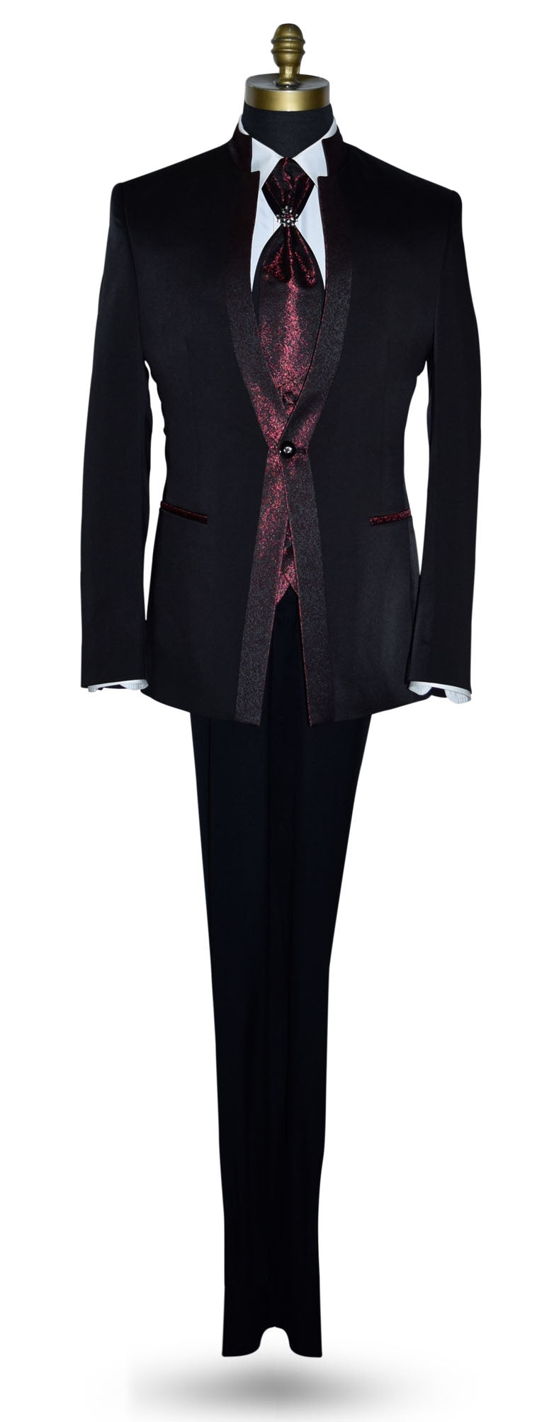 black nehru tuxedo ensemble with red accents on a mannequin against a white background