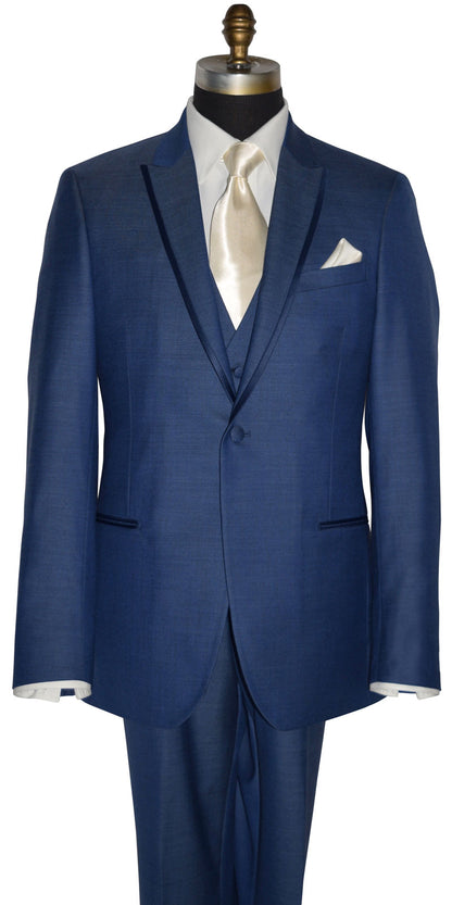 front view close up mannequin wearing a new-blue three piece tuxedo with an ivory dress shirt with an ivory long necktie and ivory pocket handkerchief against a white background