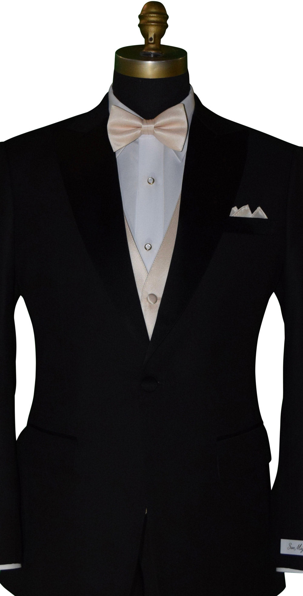 close-up Black tuxedo with nude tuxedo vest and nude "re-tied" bowtie against a white background