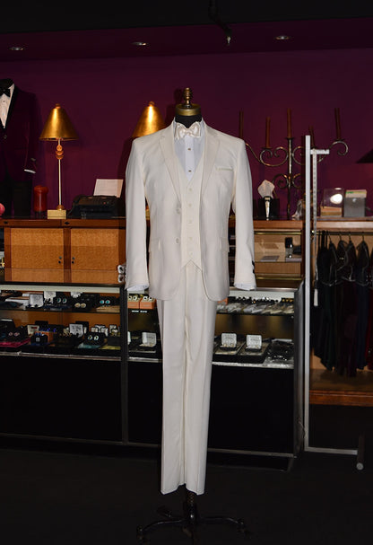 off-white mens suit with an off-white bowtie on a mannequin against a purple wall with clothing store display in the background