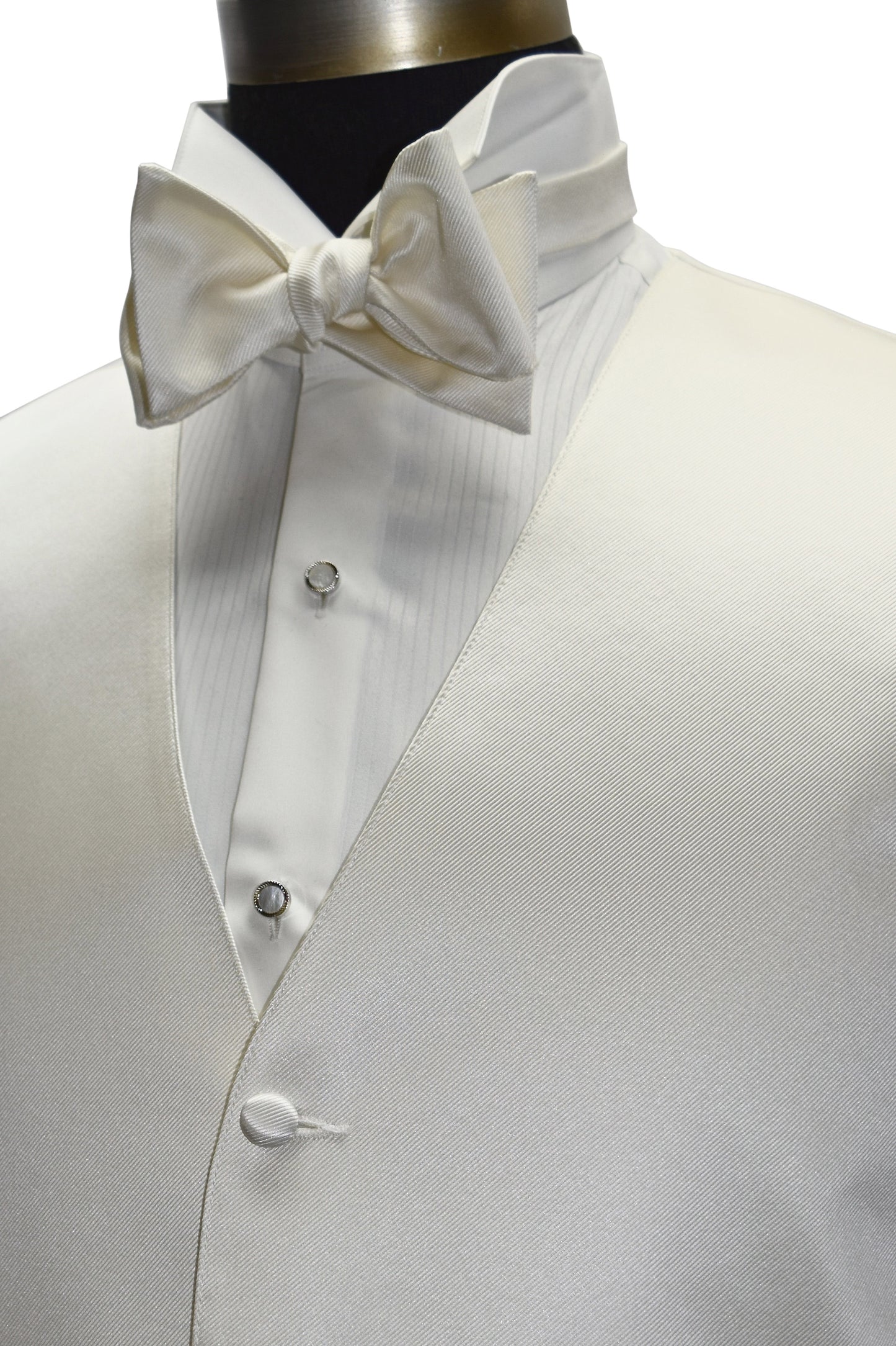 close-up side view - off-white tuxedo vest with an off-white "tie-yourself" bowtie on a mannequin against a white background