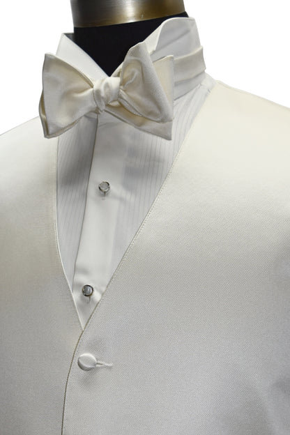 close-up side view - off-white tuxedo vest with an off-white "tie-yourself" bowtie on a mannequin against a white background