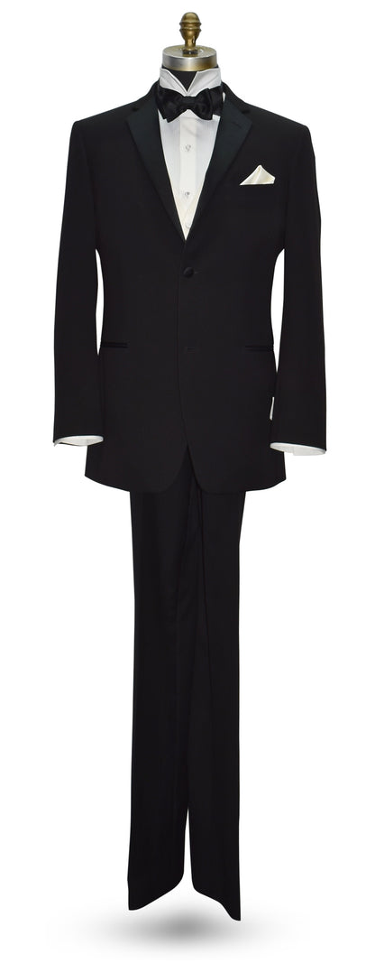 life size mannequin wearing a black tuxedo with black bow tie and off-white tuxedo vest on a mannequin against a white background
