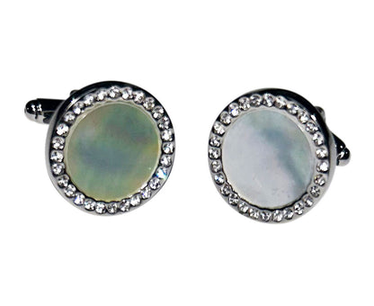 pearl cufflinks with crystal setting against a white background
