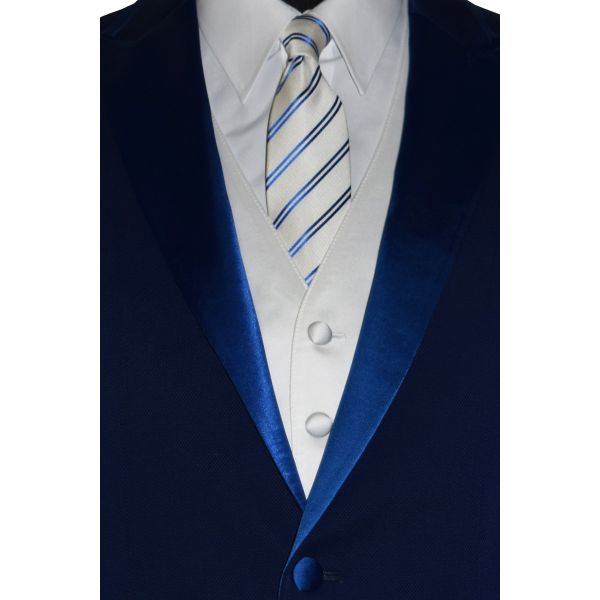very close-up Blue tuxedo on a mannequin with a white shirt , white vest and necktie tie against a white background