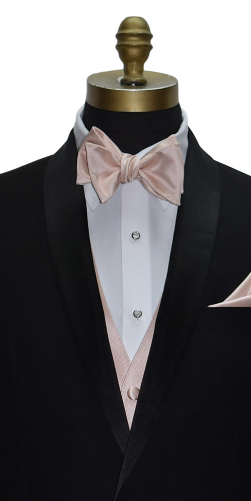 close-up black tuxedo with a petal tuxedo vest and petal "tie-ourself" bow tie on a mannequin with a white background