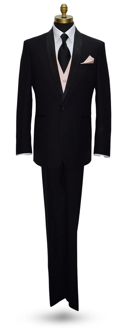 life-size mannequin wearing a black shawl-collar tuxedo with a black silk dress necktie and a petal tuxedo vest and pocket handkerchief, against a white background 