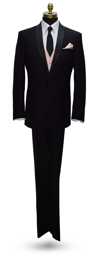 life size mannequin wearing a black shawl-collar tuxedo with a white dress shirt and black skinny necktie with a petal tuxedo vest.