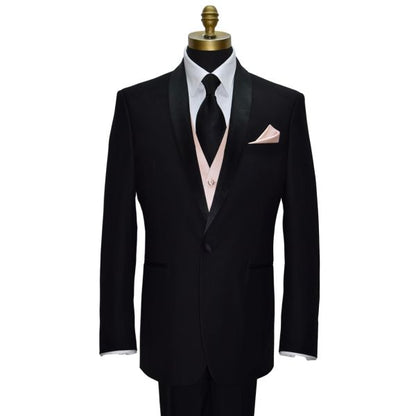 mannequin wearing a black shawl-collar tuxedo and white tuxedo shirt with a black silk necktie and a petal tuxedo vest against a white background