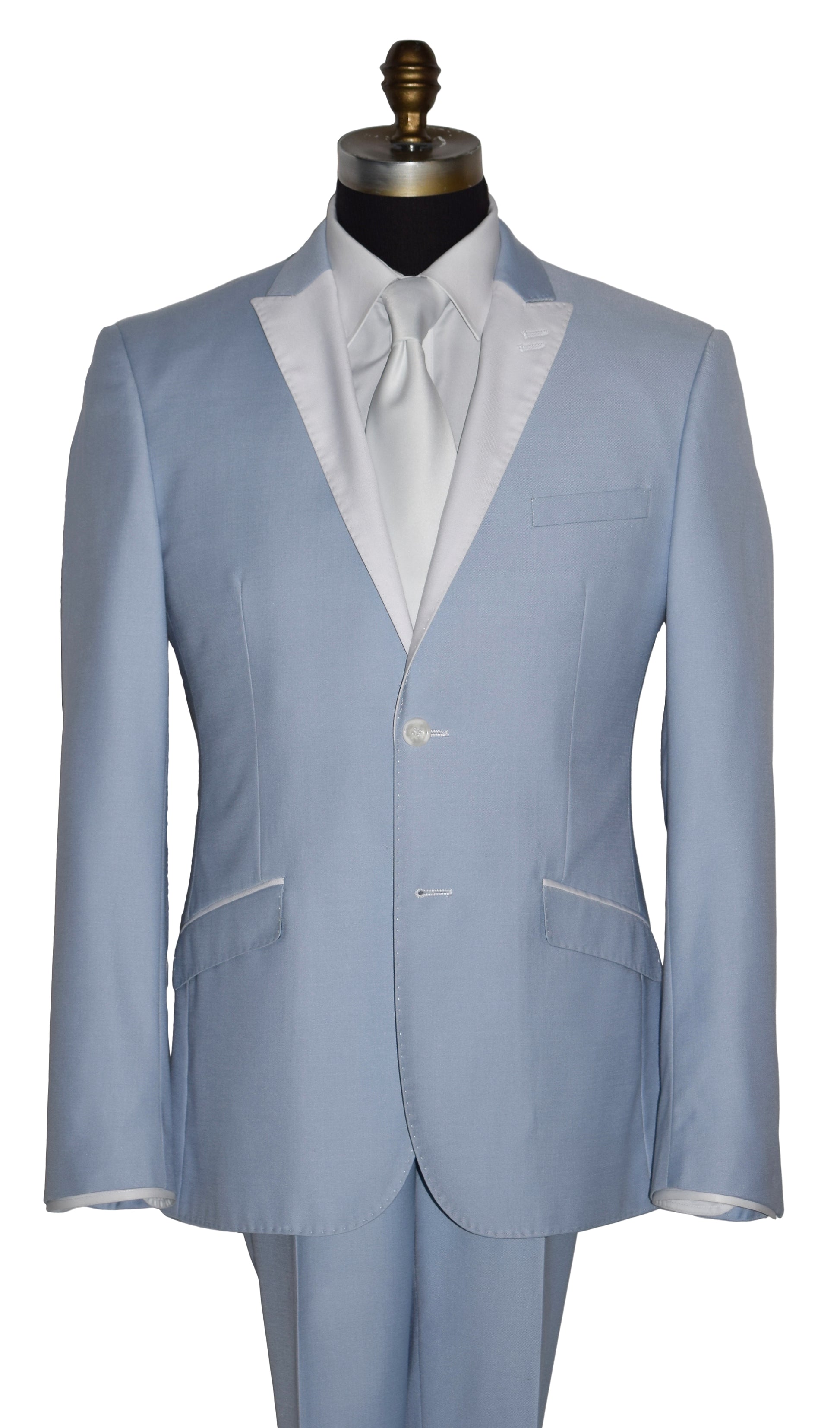 close-up life size mannequin wearing a powder-blue tuxedo with a white shirt and a white satin necktie on a mannequin against a white background