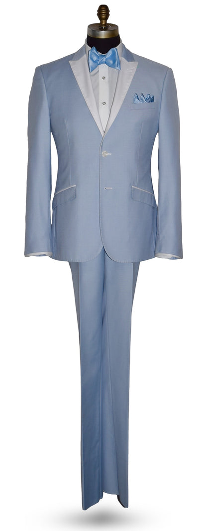life size mannequin wearing a powder blue tuxedo with a blue bowtie against a white background