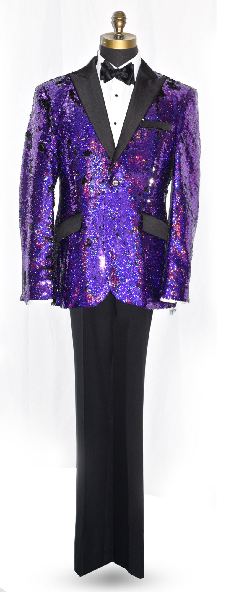 Purple sequin tuxedo with black lapels and pants on a mannequin against a white background