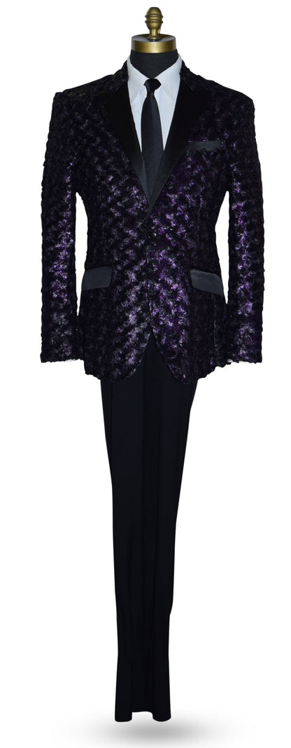 life size mannequin wearing a purple tuxedo with black lapels with a white tuxedo shirt and long black skinny necktie against a white background