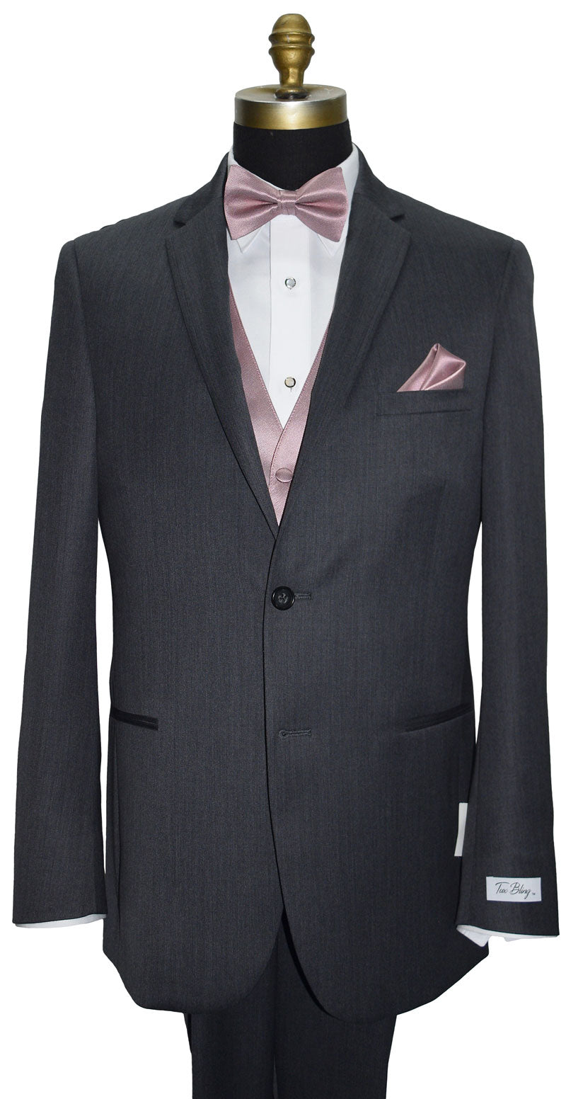 Gray wedding suit with quartz "pre-tied" bow tie and quartz tuxedo vest on a mannequin against a white background