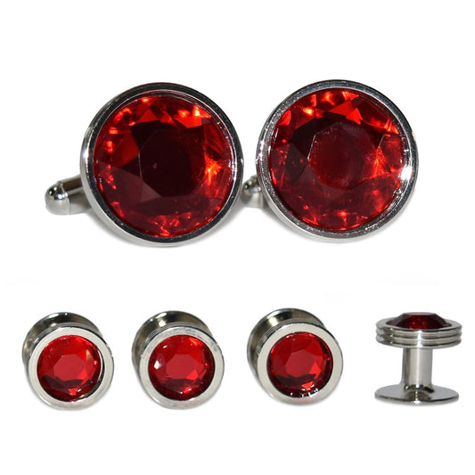 Set of red gemstone cufflinks and studs on a white background