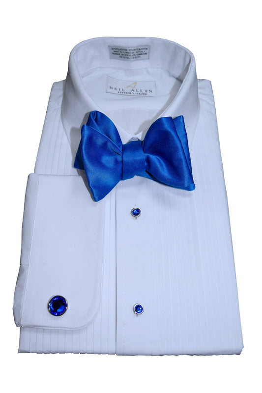 White dress shirt with a royal blue "tie-yourself" bow tie and cufflinks on a white background