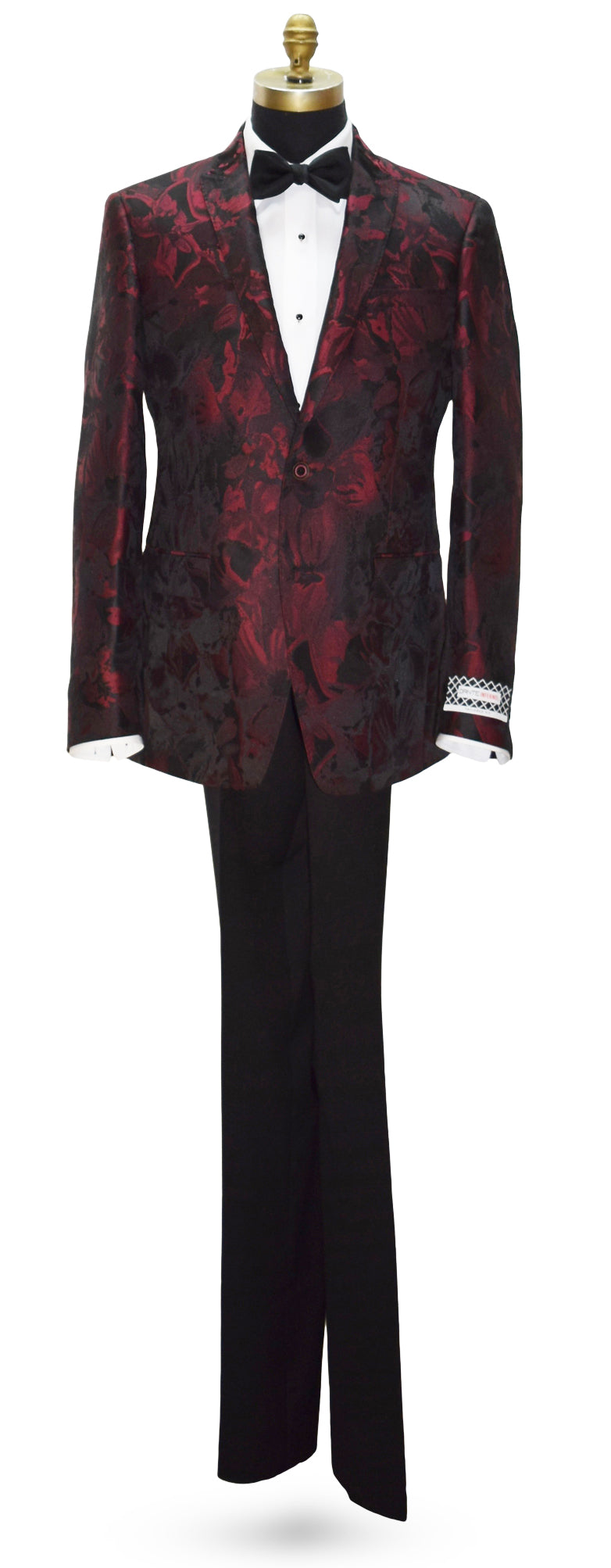 Red floral-patterned tuxedo jacket and black pants on a mannequin against a white background