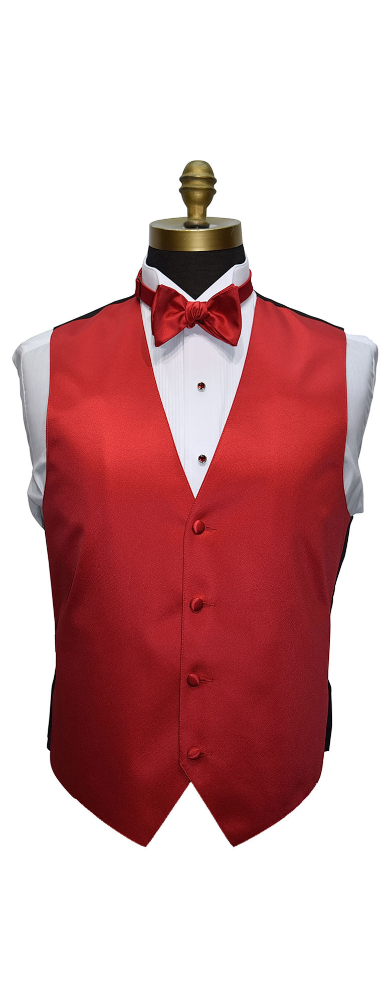 close-up mannequin wearing a white wing collar tuxedo shirt with a ruby-red bowtie and ruby-red tuxedo vest against a white background 