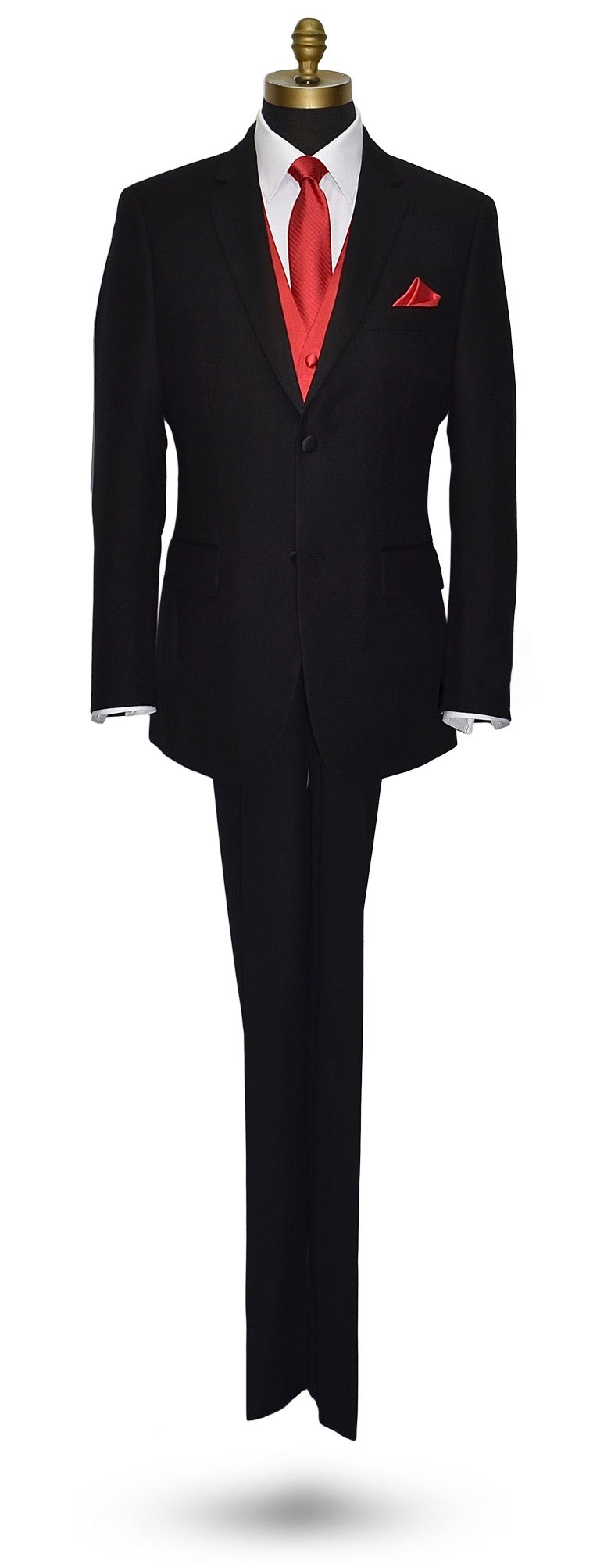 life-size mannequin wearing a black notch-lapel tuxedo with a white dress shirt with a ruby-red long necktie and ruby red vest and pocket handkerchief against a white background