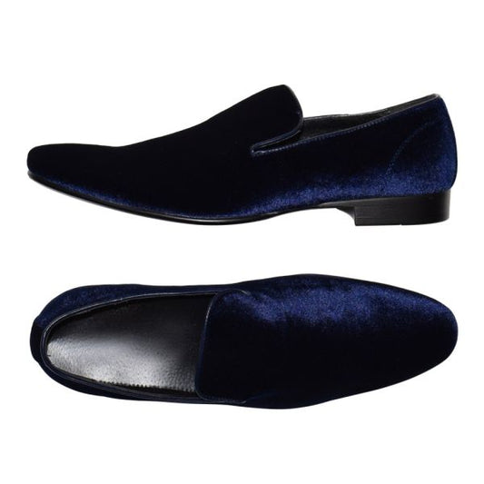 A pair of sapphire blue velvet slip-on men's pumps.