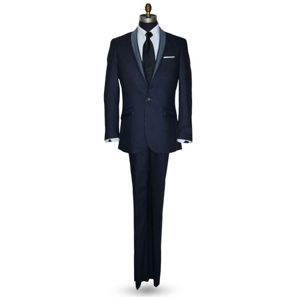 life size mannequin wearing a serene blue shawl collar tuxedo with a wide black satin necktie against a white background