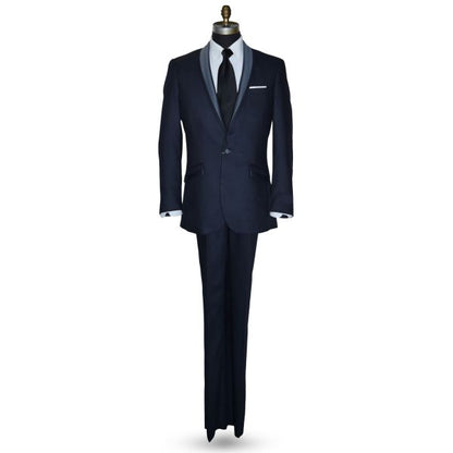 life size mannequin wearing a serene blue shawl collar tuxedo with a wide black satin necktie against a white background