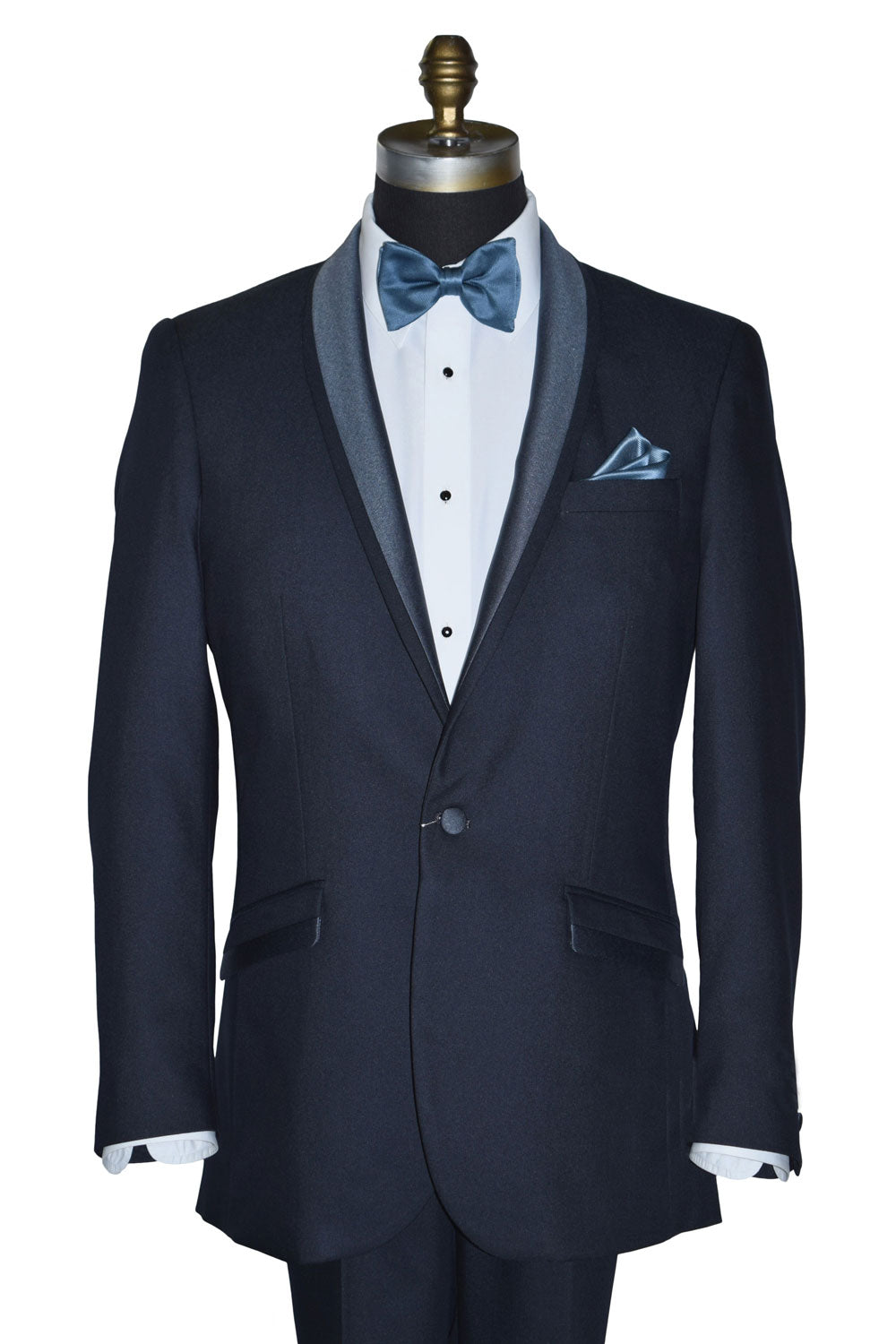 close-up life size mannequin wearing a serene blue shawl collar tuxedo with a blue bowtie against a white background