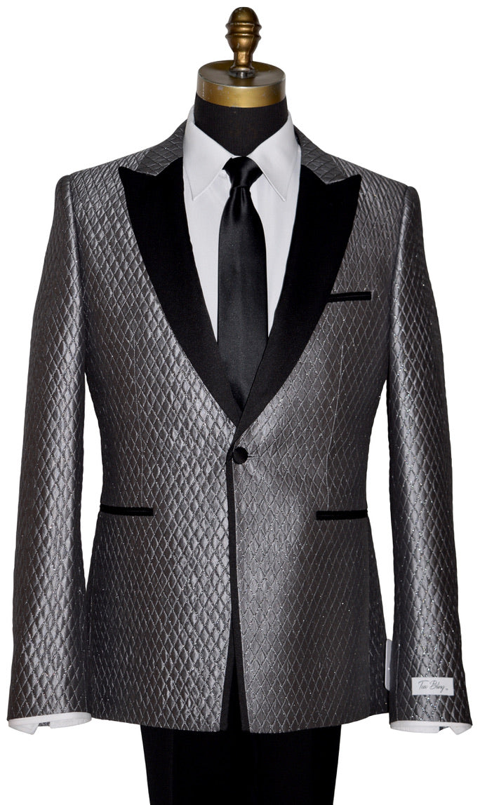 Silver-gray peak lapel tuxedo with a skinny black necktie on a mannequin against a white background