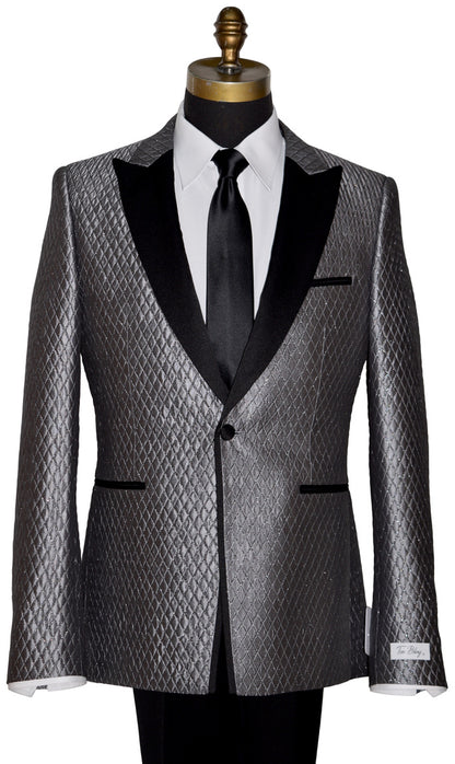 Silver-gray peak lapel tuxedo with a skinny black necktie on a mannequin against a white background