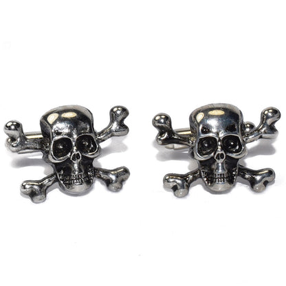 Pair of silver "skull and crossbones" cufflinks on a white background