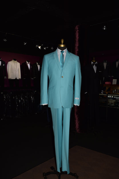 tiffany blue suit on a mannequin against a wall with other suits on display