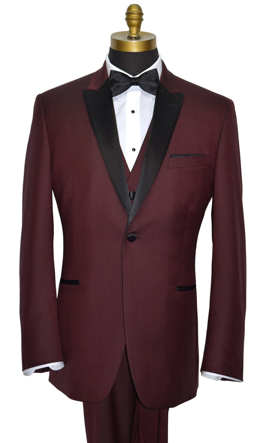 Maroon tuxedo with black lapels on a mannequin against a white background