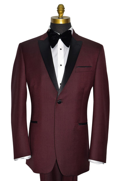 Burgundy tuxedo with black lapels on a mannequin against a white background