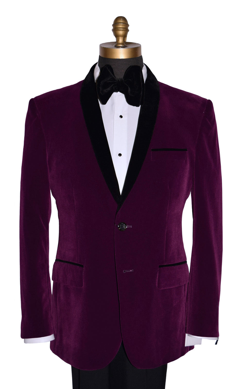 Purple velvet tuxedo jacket with black lapels with a black velvet butterfly-bowtie on a mannequin against a white background
